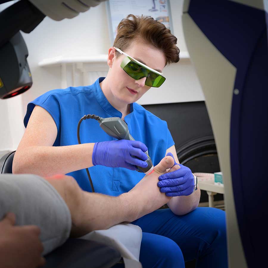 MLS Laser Therapy - 2834 - Stephanie The Podiatrist Alleviating Pain Int He Big Toe Joint Using Mls Laser Therapy.
